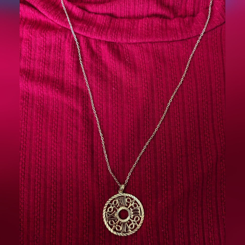 925 gold colored necklace with unique charm. Classy, 16 inch chain.